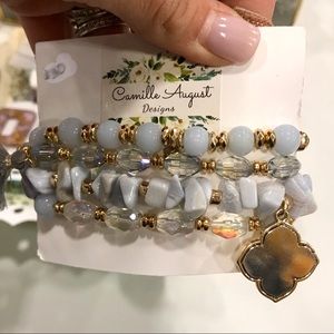 Light blue bracelet stack with blue stone bracelet